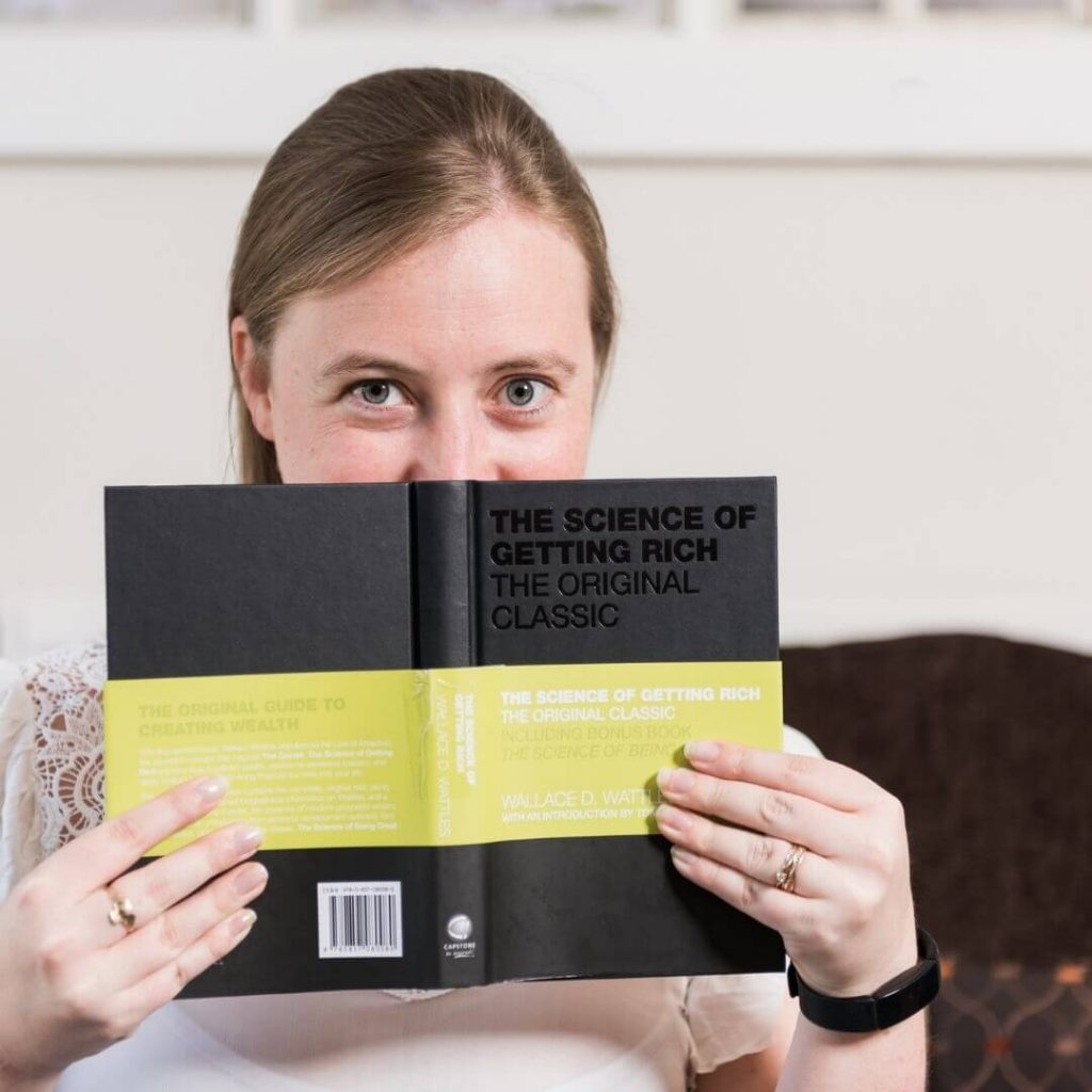 Jacky reading a book about success and greatness